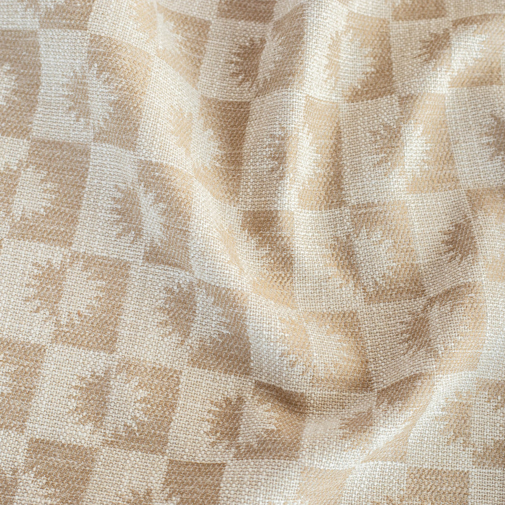 Iris Fabric Wicker, a cream and beige brown checkboard sun motif patterned upholstery fabric from Tonic Living