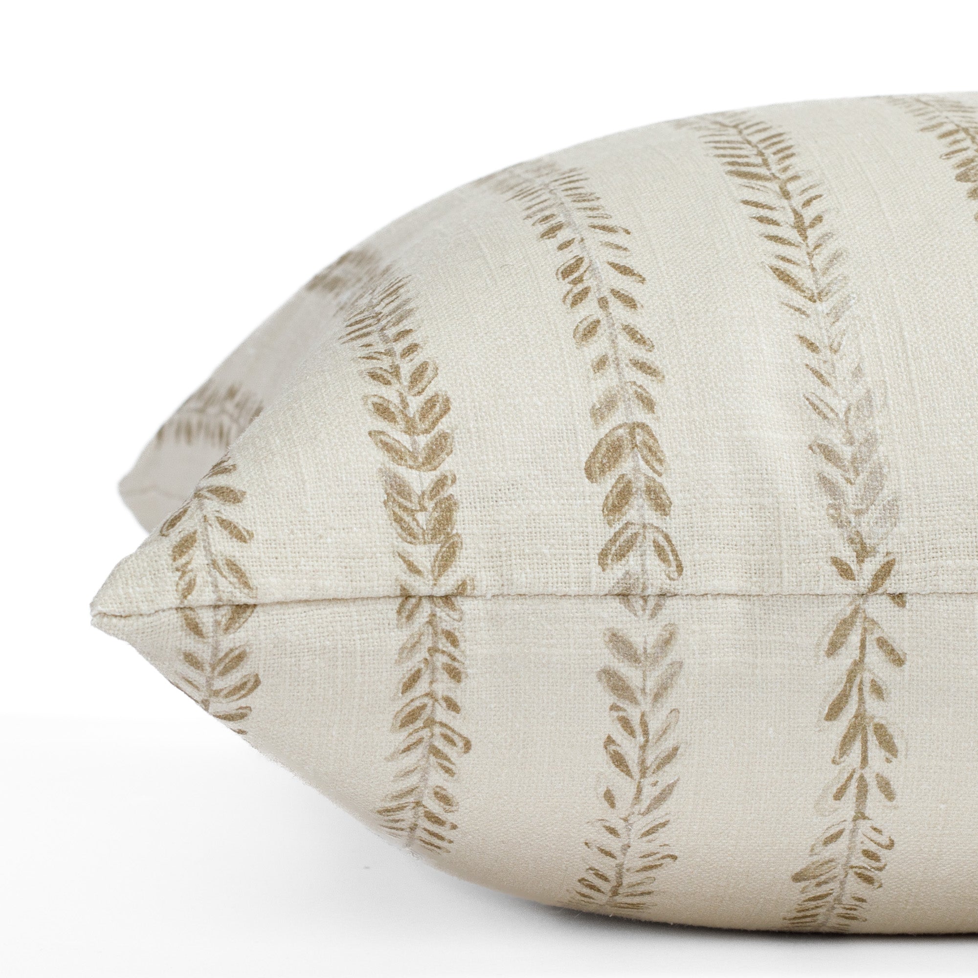 a chestnut brown and cream leaf vine  block print pillow : close up side view