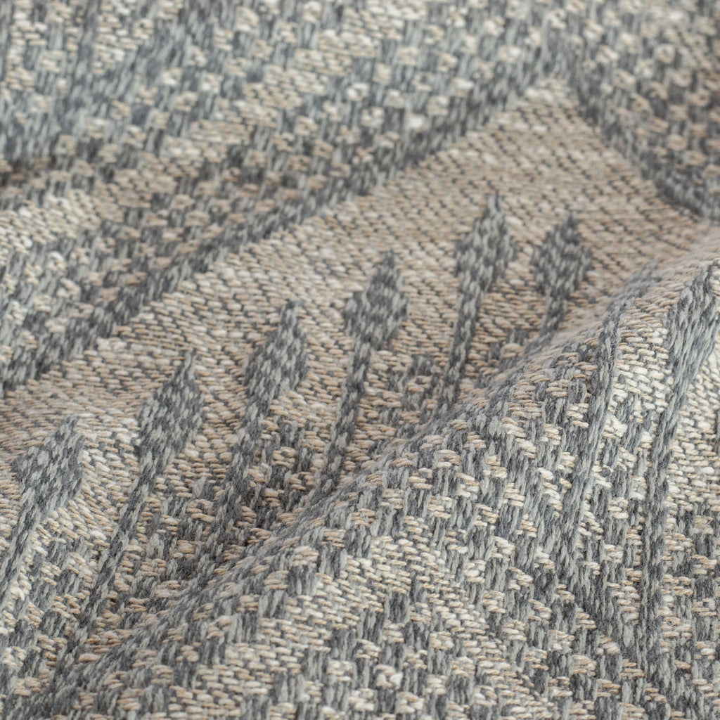a warm grey and stone blue tapestry woven upholstery fabric :close up view