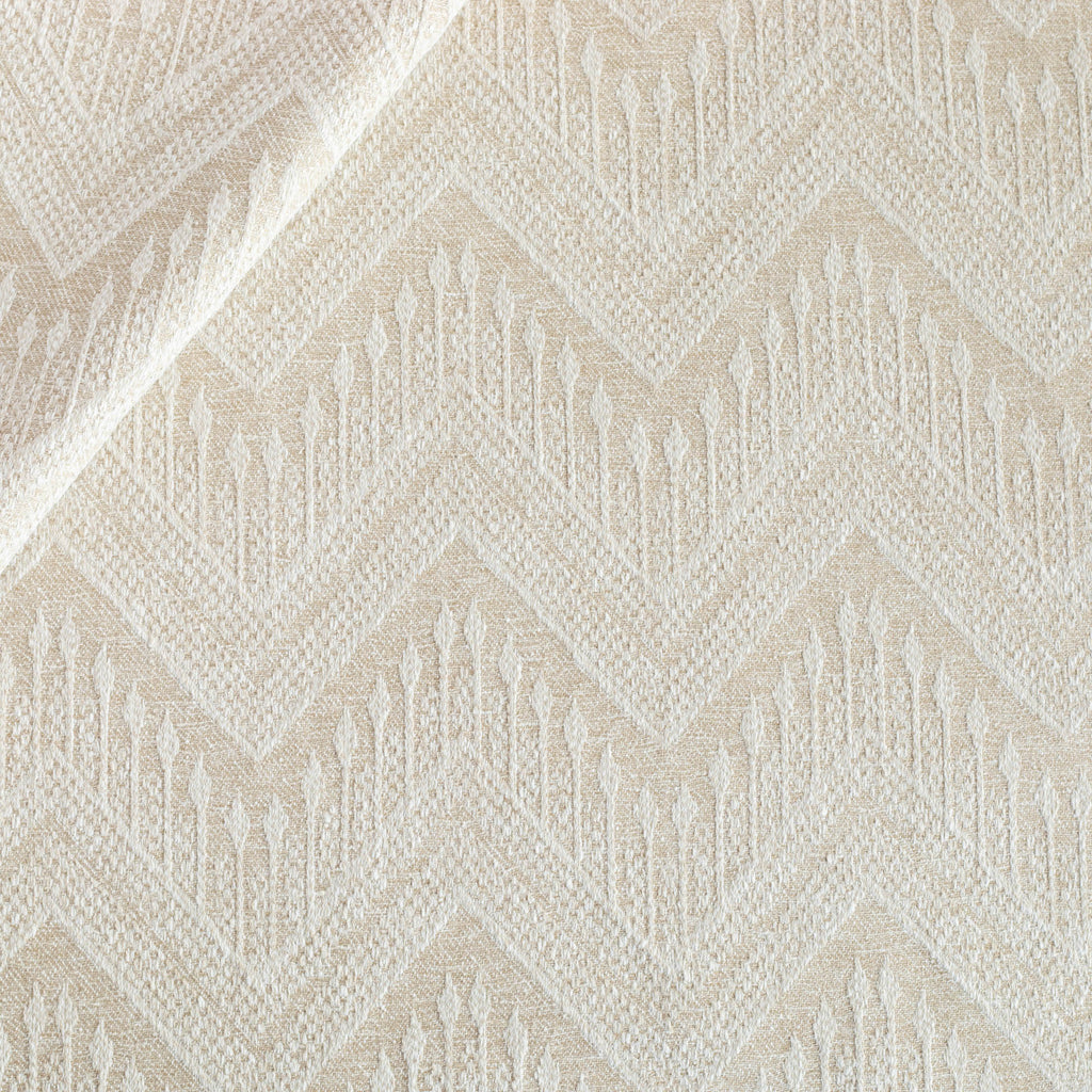 Joyce Fabric Natural, a beige upholstery fabric with a delicate woven white geometric zig zag pattern from Tonic Living