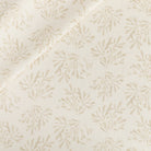 Tonic Living Juniper Fabric in Parchment, a neutral botanical print drapery fabric in cream and beige.