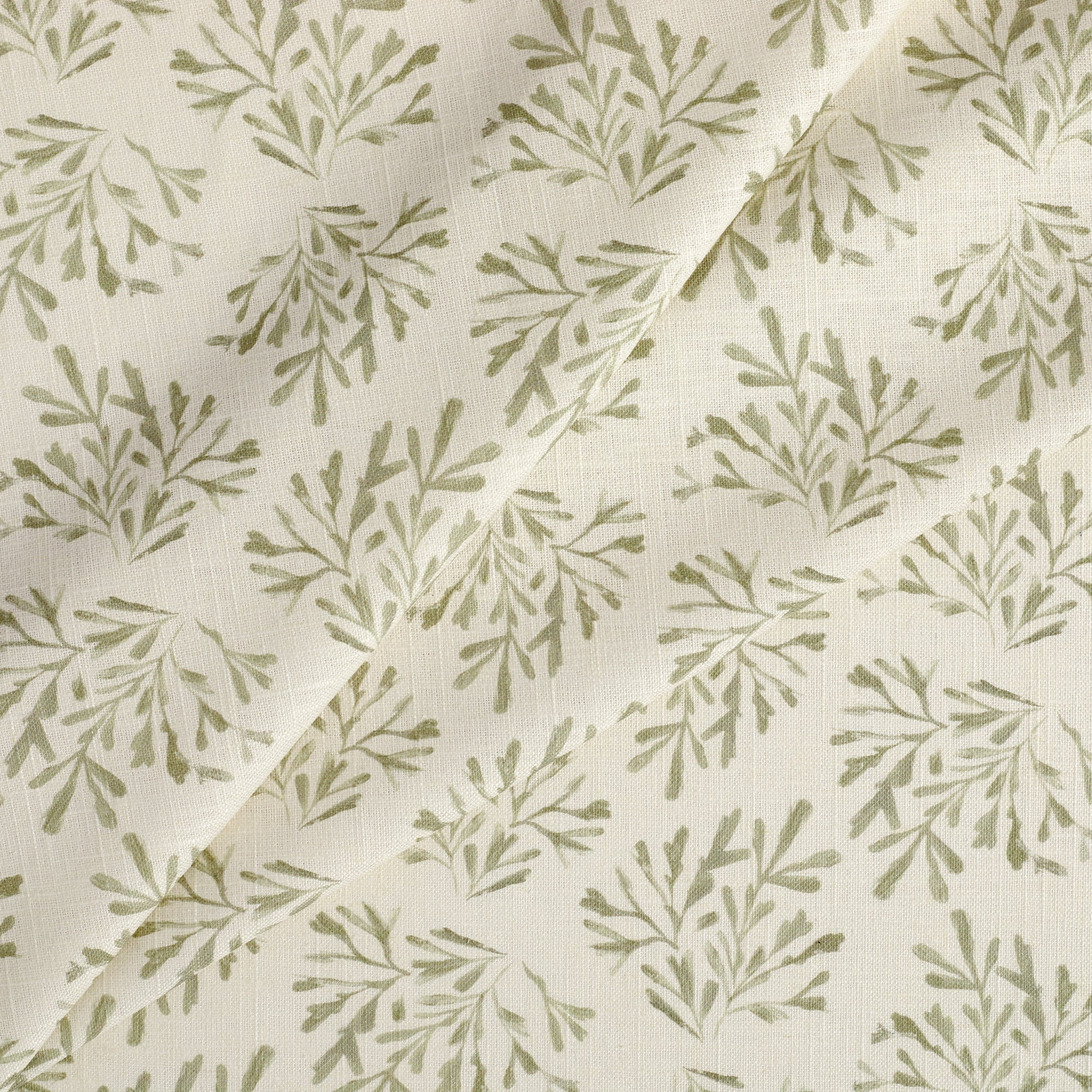 Tonic Living Juniper Sage drapery fabric featuring a delicate botanical vine and sprig design.