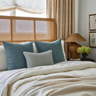 A styled bedroom moment, with Tonic Living's Bedford Denim Blue throw pillows and Kensington Lagoon lumbar.
