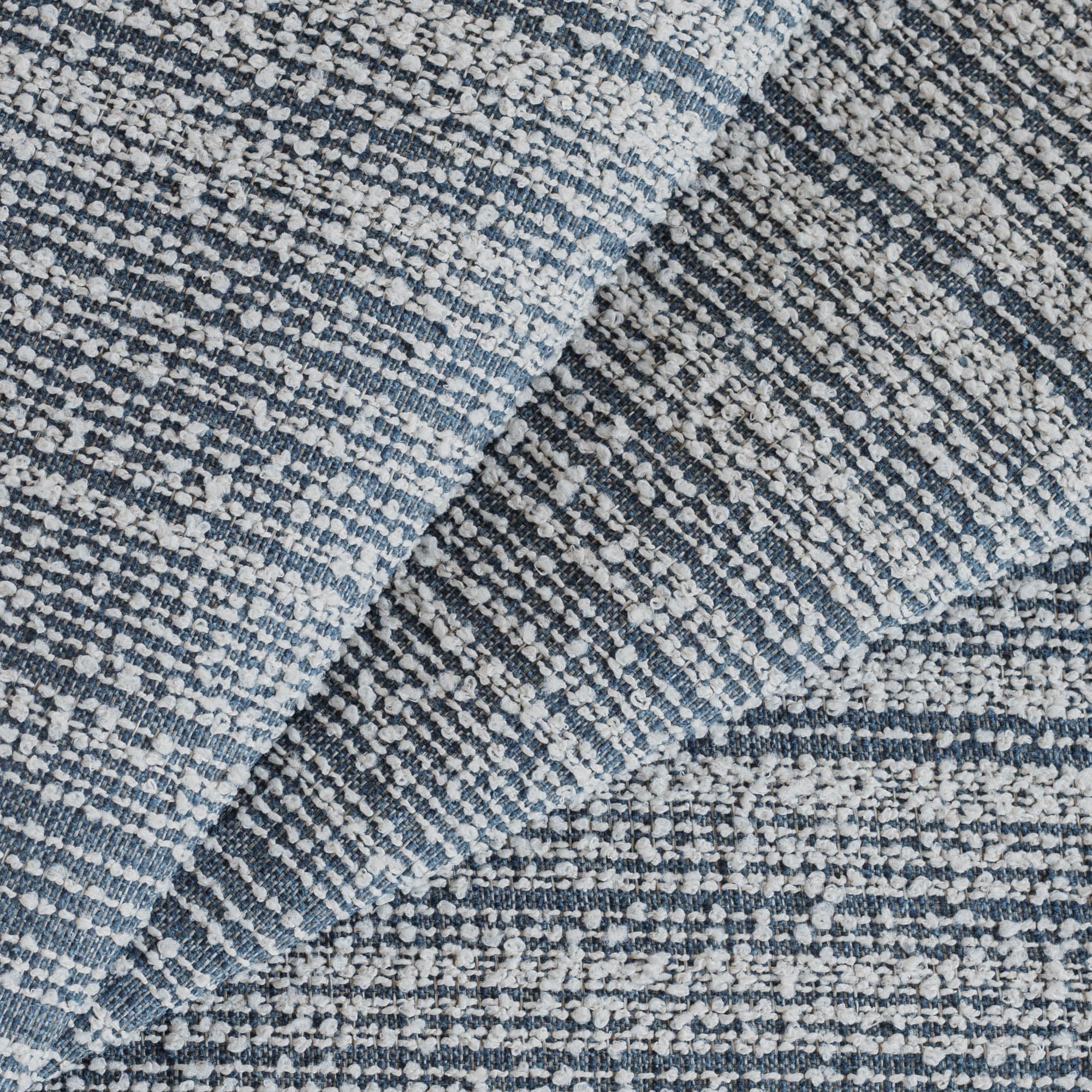 a denim blue and white loopy striped upholstery fabric
