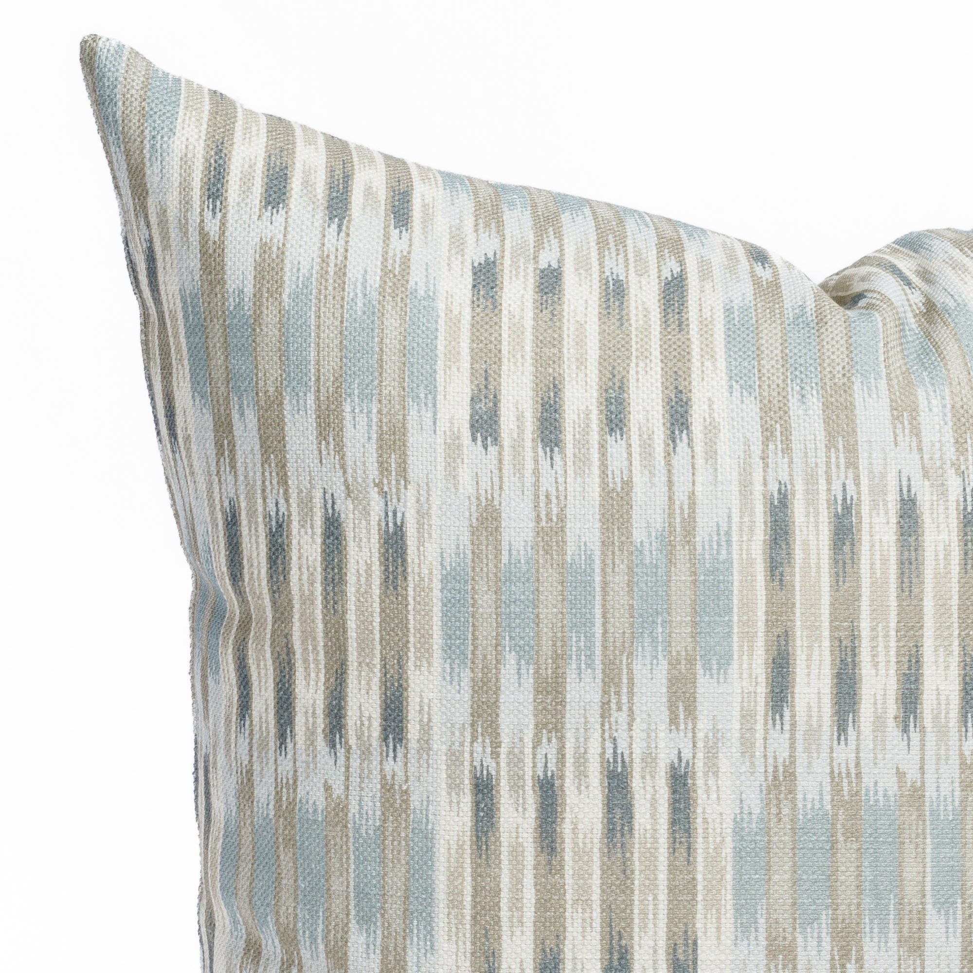 a watery blue, sand and white ikat print throw pillow : corner detail
