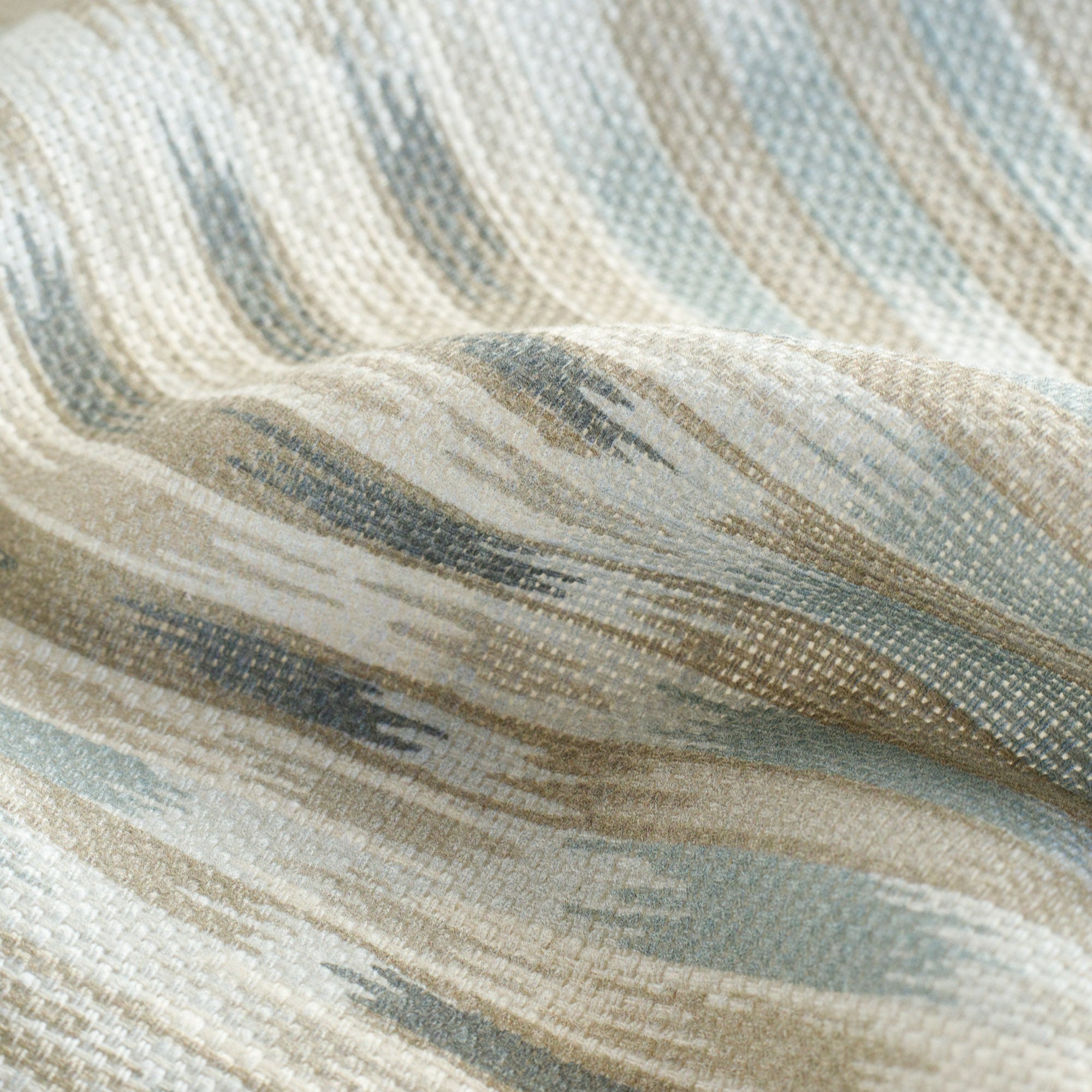 a blue and sandy beige ikat print home decor fabric