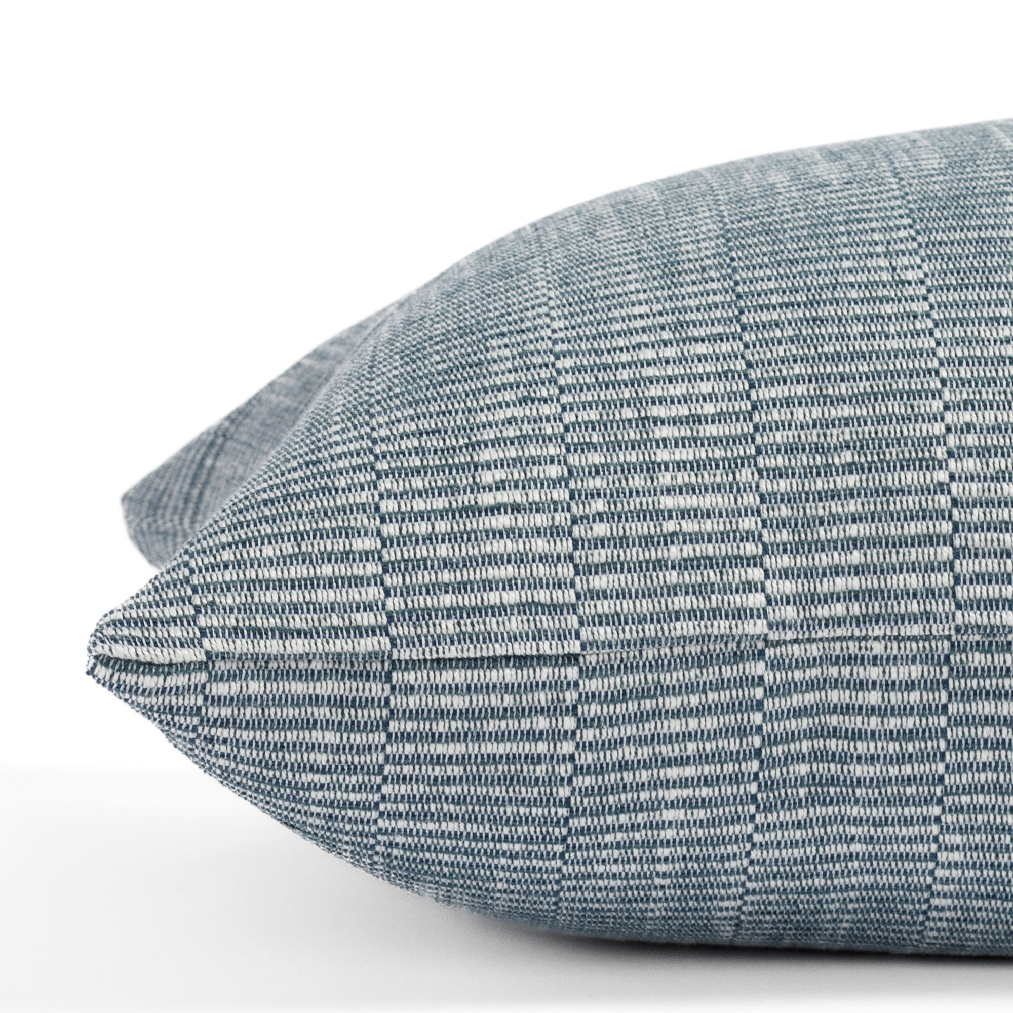 a blue and white textured stripe extra long lumbar throw pillow : close up side view