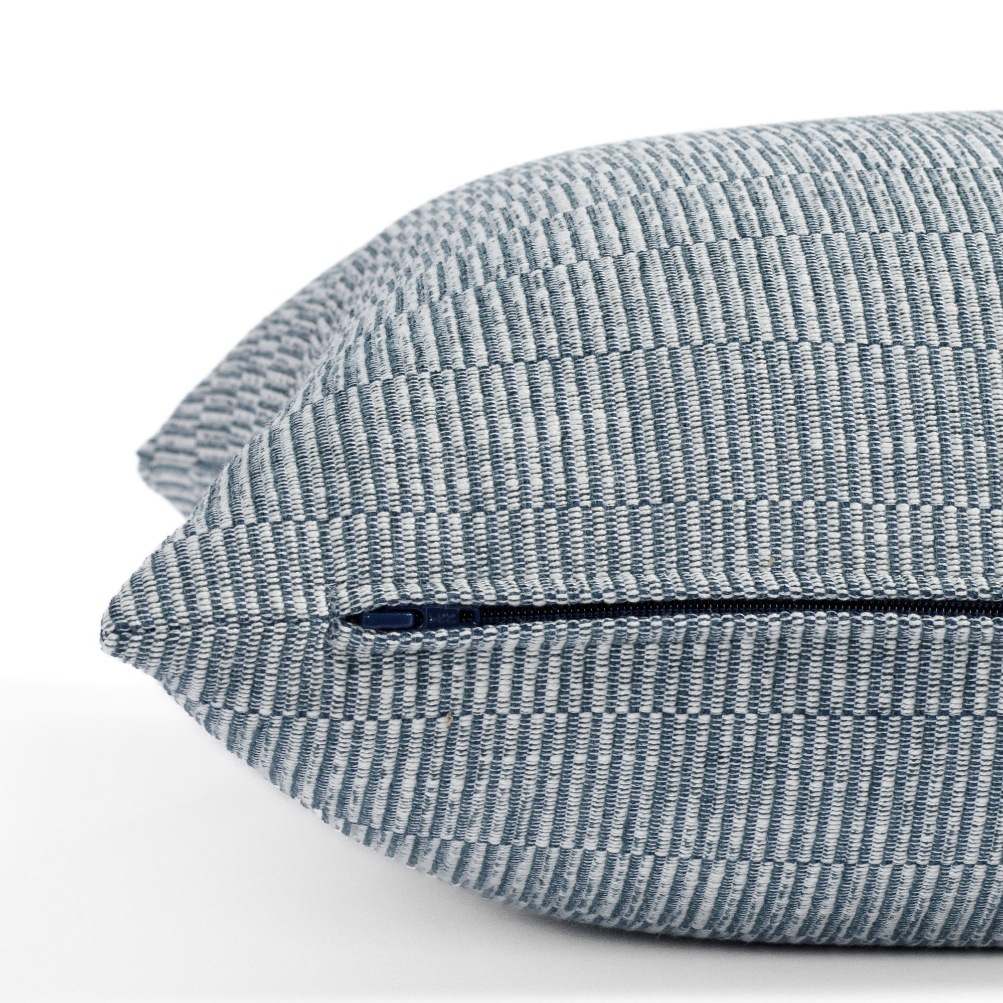 a blue tonal stripe throw pillow : close up zipper detail