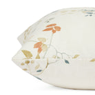 Side view of Tonic Living Laurel Meadow pillow highlighting its floral vine print design.