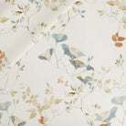 Tonic Living Laurel Fabric in Meadow, a botanical print drapery fabric in blue, terracotta, and white.