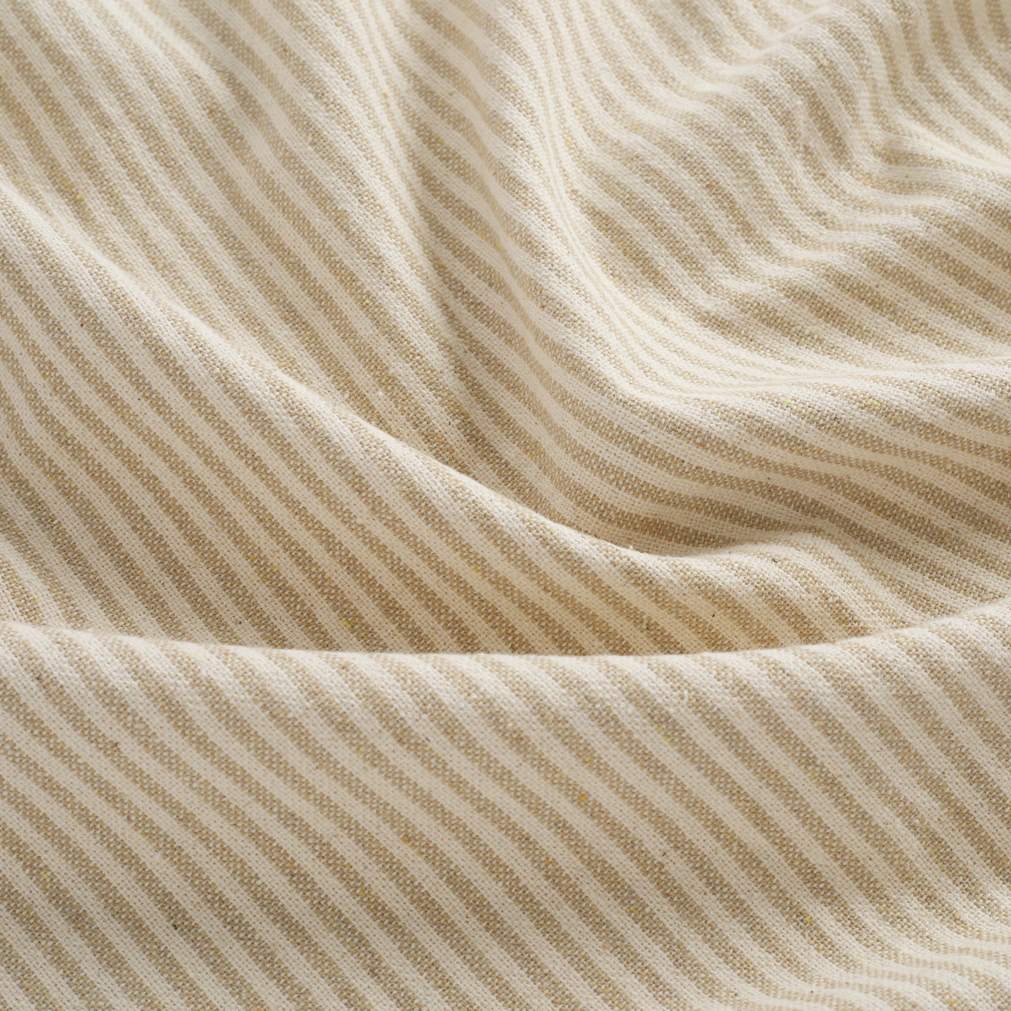 Close up of Tonic Living Leo Stripe Wheat fabric showing wheat and natural vertical stripe detail.