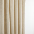 Tonic Living Leo Stripe Wheat curtain fabric shown as drapery with a beige and natural stripe design.