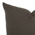 Close-up of Loden Mink throw pillow by Tonic Living — solid soft brown cushion with smoky grey undertones and a linen-look weave.