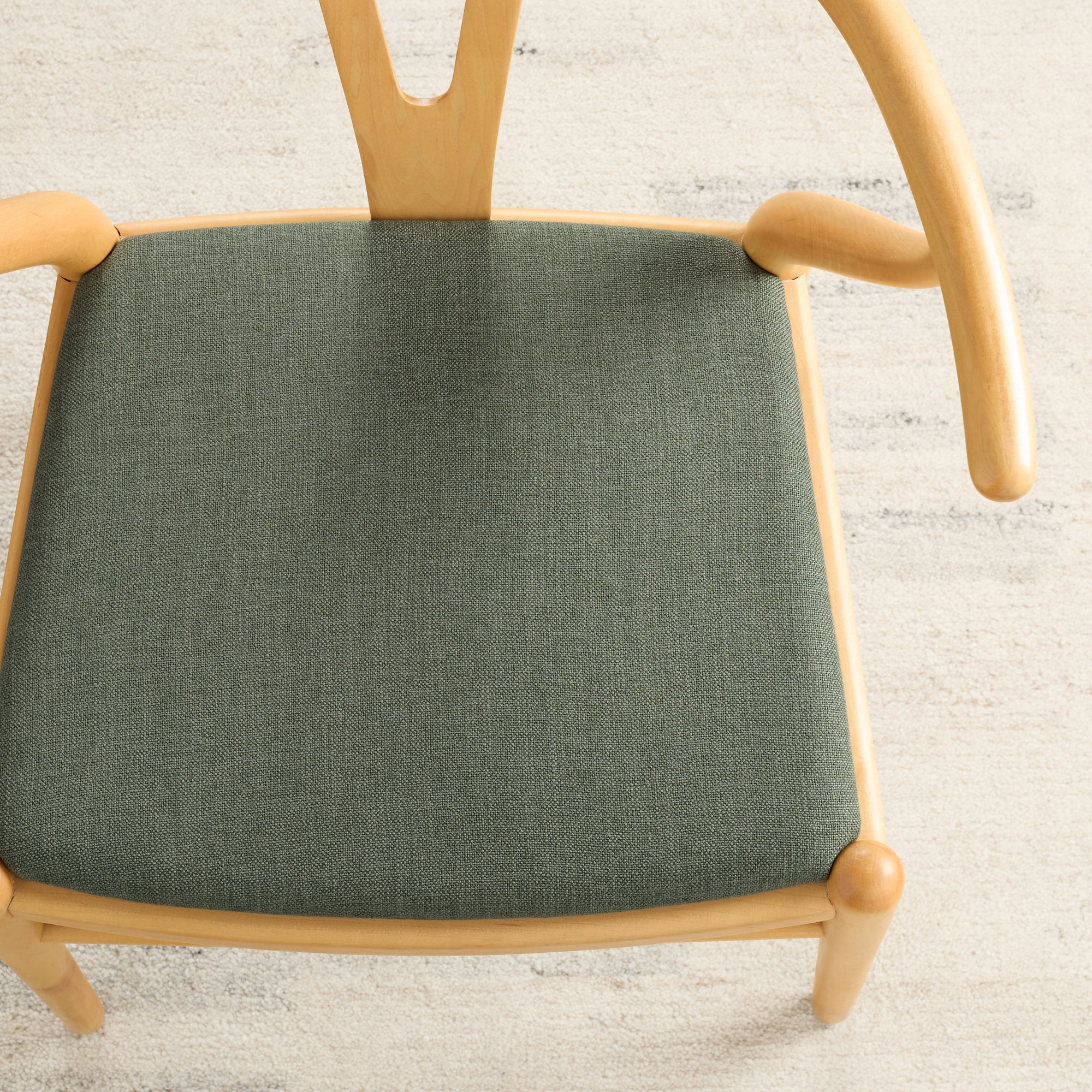 Dining seat upholstered in Loden Fabric, Sage by Tonic Living — durable high-performance sage green upholstery fabric.