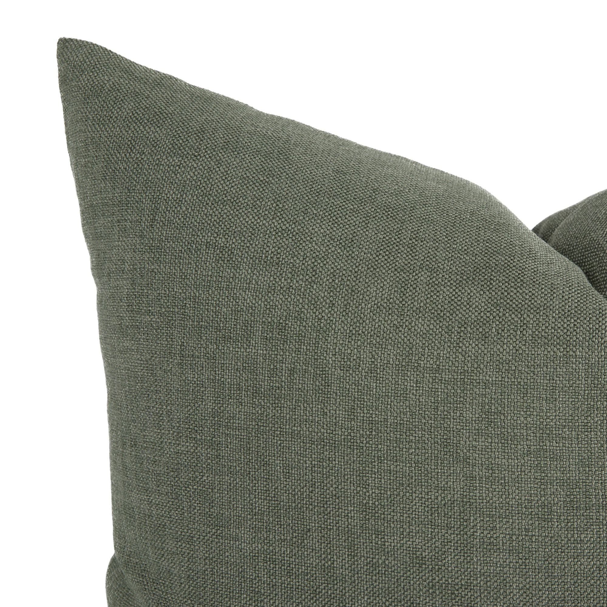 Close-up of Loden Sage throw pillow by Tonic Living — solid sage green cushion with a subtly textured, linen-look finish.