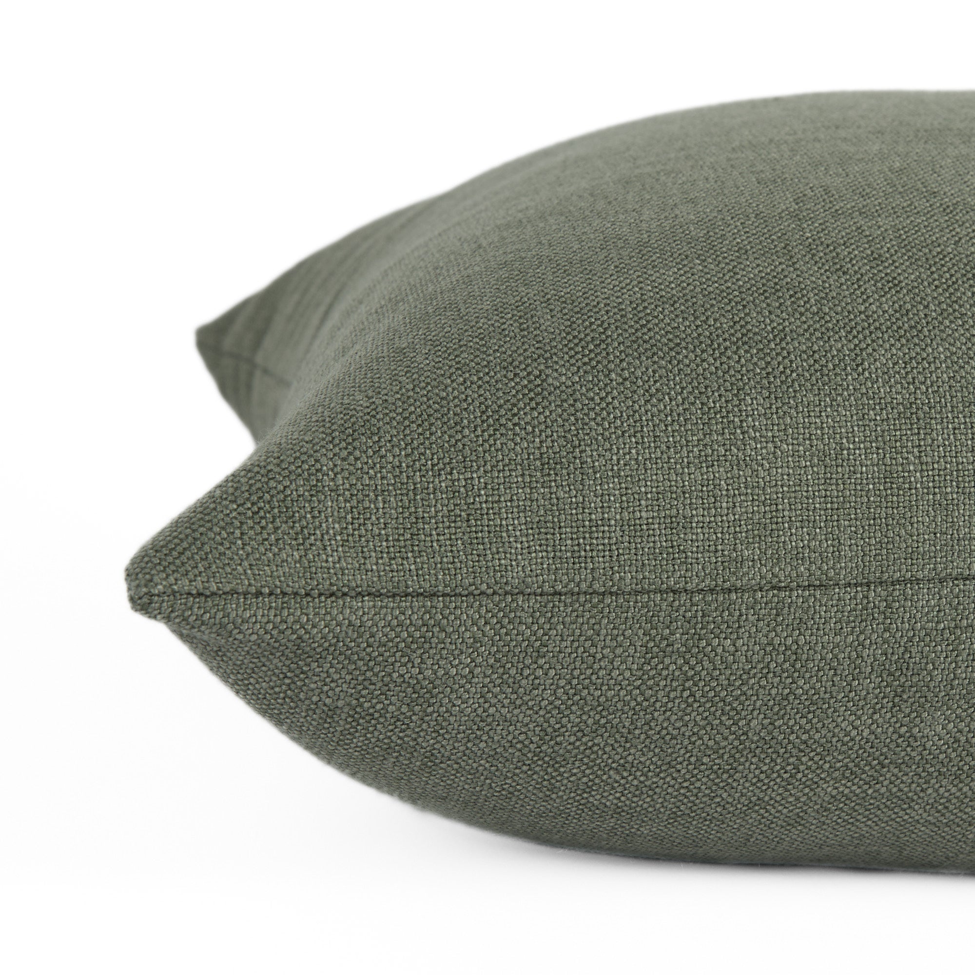 Close-up side view of Loden Sage toss pillow by Tonic Living — dusty sage green tone with a relaxed, organic texture.