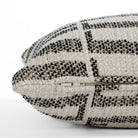 Side detail of Tonic Living’s Mallia 12x24 lumbar toss pillow, highlighting the discreet zipper and durable InsideOut® outdoor fabric in a black and neutral palette.