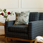 Manor Tapestry 20x20 accent pillow in sage green styled on a chair, featuring vintage botanical tapestry look.
