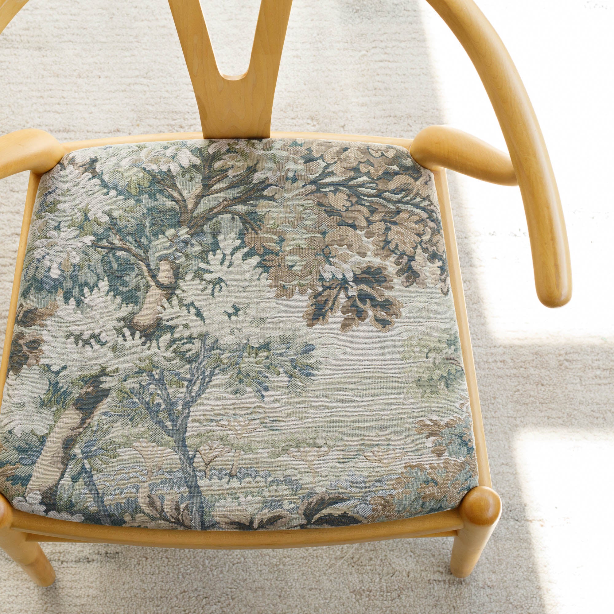 Dining chair in Tonic Living Manor Tapestry Moss French-style chair upholstery fabric.