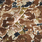 Tonic Living Marbella Fabric in Inkwell, a multicolour abstract floral fabric featuring expressive blooms in rich browns and blue.