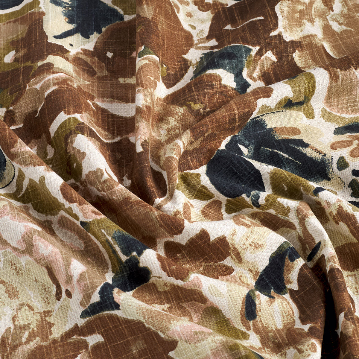 Tonic Living Marbella Inkwell drapery fabric featuring large-scale abstract flowers in rich brown and deep blue tones.