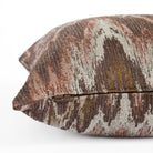 Side zipper detail of Tonic Living Mendoza 20x20 pillow in earthy plum and terracotta pink tones.