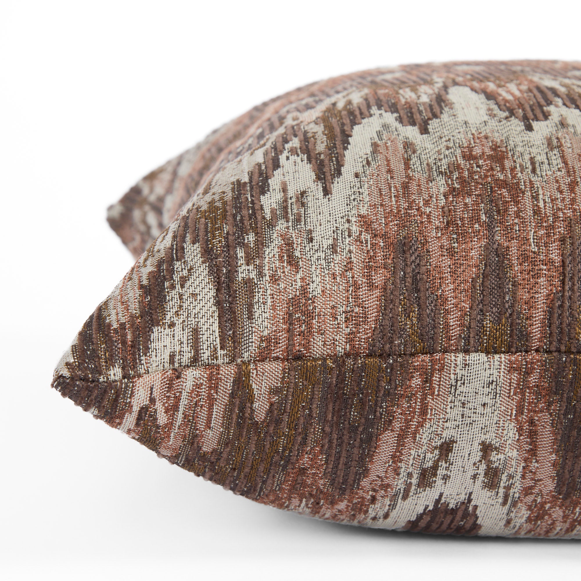 Side view of Tonic Living Mendoza Fig throw pillow highlighting its textured abstract pattern.