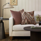 Tonic Living Mendoza Fig throw pillow styled on a sofa with the Florence Velvet mauve cushion.