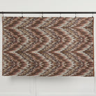 Full yard of Tonic Living Mendoza Fig upholstery fabric hanging to show scale and pattern repeat.