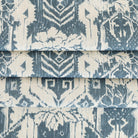 a cream and blue botanical ikat print linen blend fabric