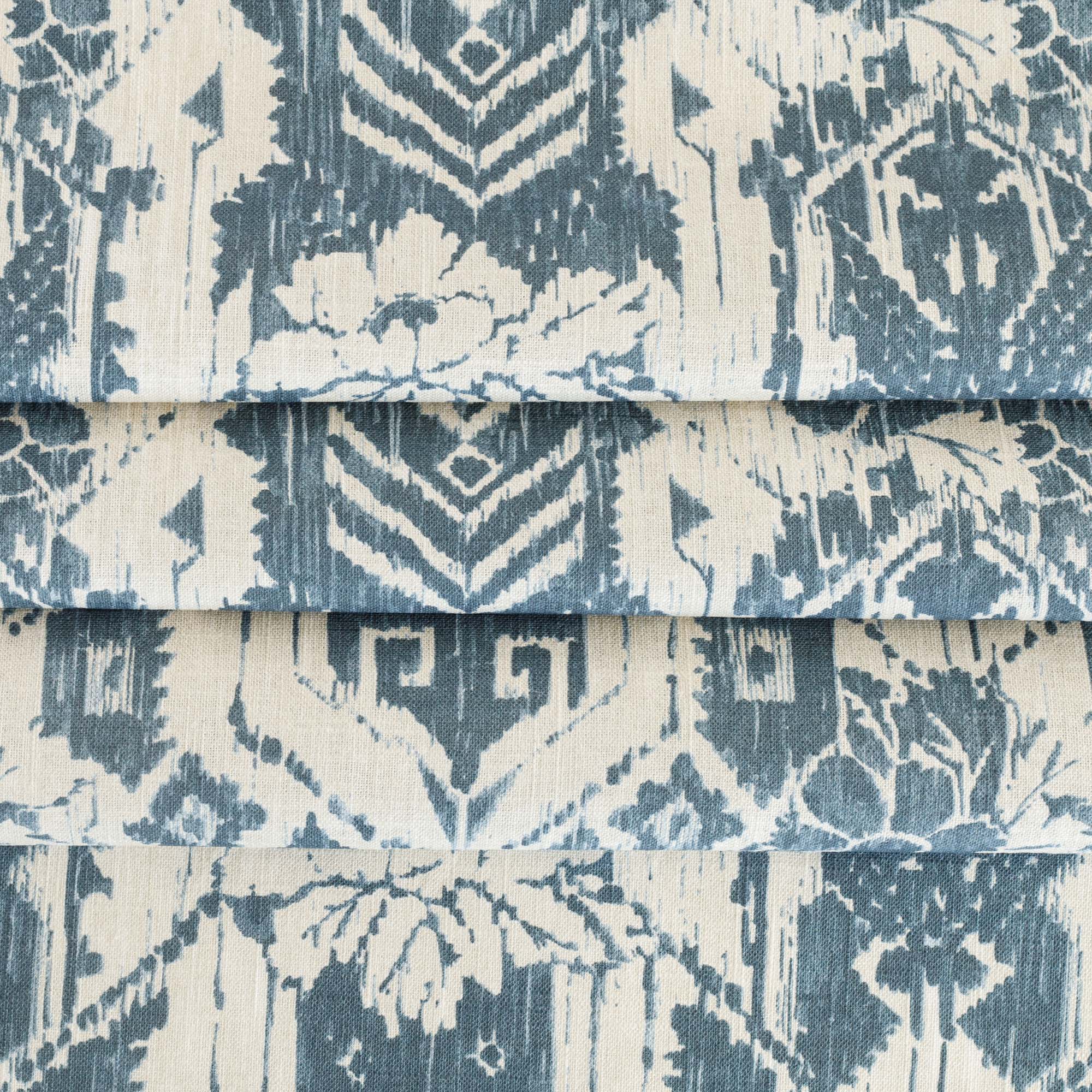 a cream and blue botanical ikat print linen blend fabric