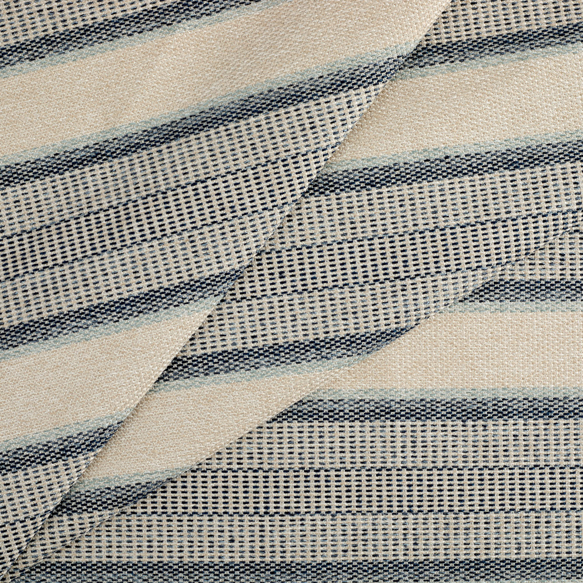 Tonic Living Miller Stripe Fabric in Denim, a blue striped high-performance fabric with varied widths and woven texture.
