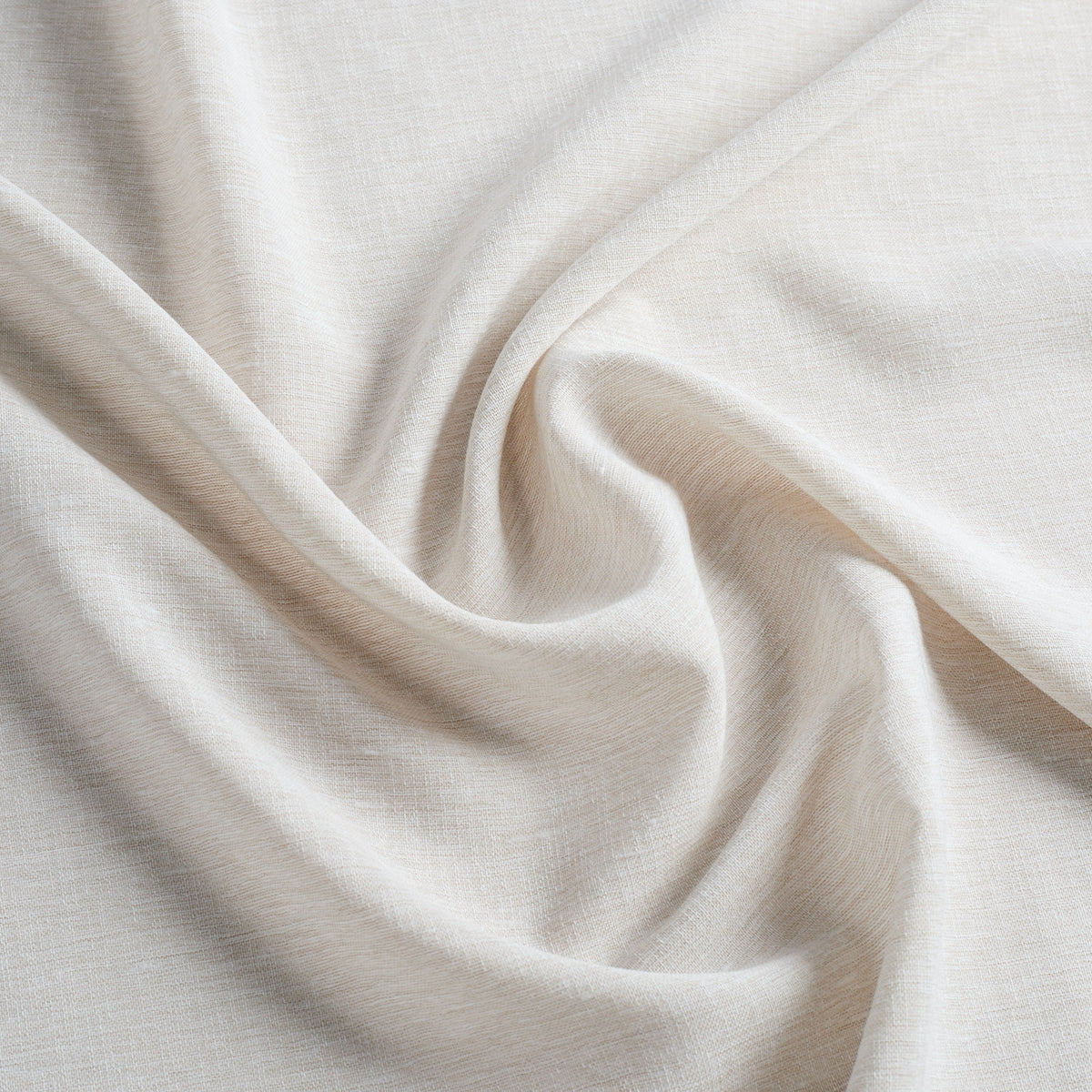 Tonic Living Monaco Sheer Fabric in Fog, a soft beige sheer drapery fabric with subtle woven texture.