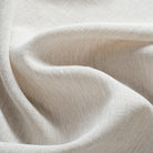 Tonic Living Monaco Sheer Fabric in Fog, a beige sheer curtain fabric with a translucent light-filtering weave.
