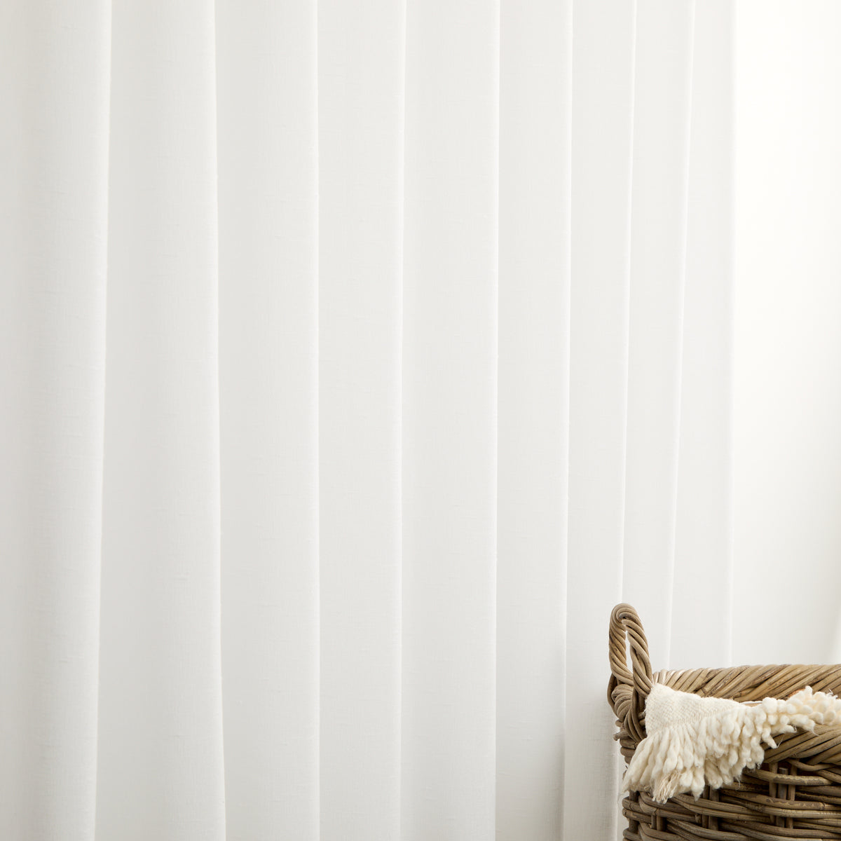 Tonic Living Monaco Sheer Salt shown as white sheer curtains that gently filter natural light.