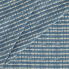 Tonic Living Nile Indigo home decor fabric with a modern coastal dotted stripe pattern.
