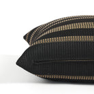Side zipper detail of Tonic Living Odessa Stripe 20x20 outdoor toss pillow in black and tan stripe.