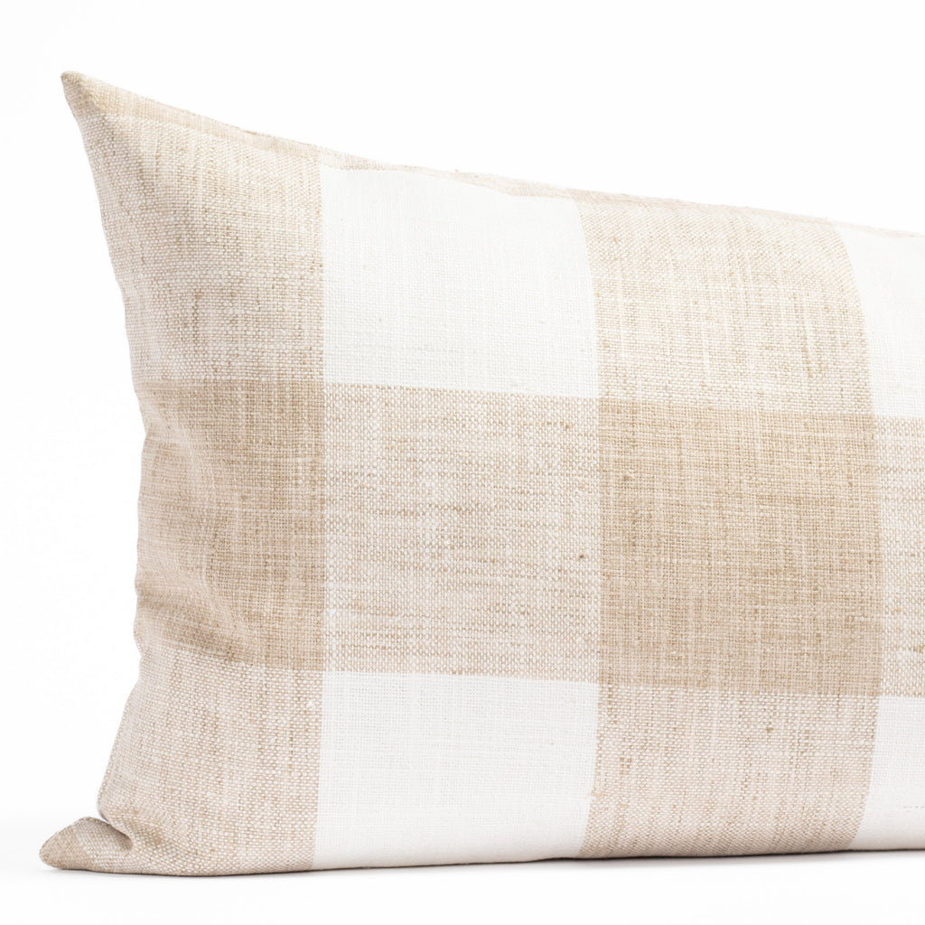 a soft white and sandy beige buffalo check patterned bed bolster pillow from Tonic Living : close up view