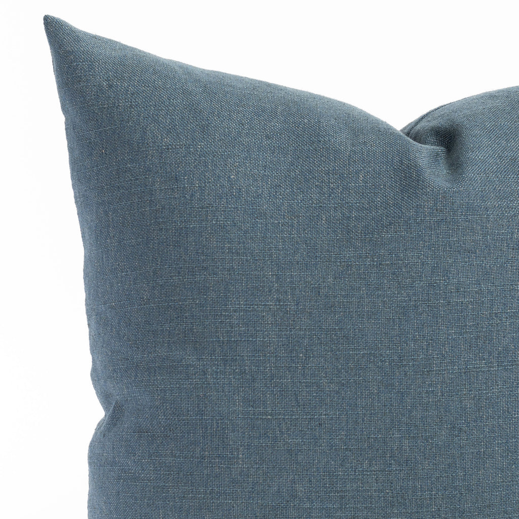 an indigo solid blue throw pillow: close up view