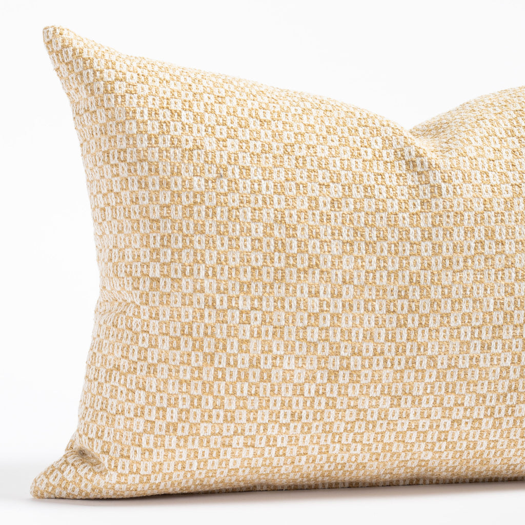 a yellow and cream small geometric check patterned lumbar throw pillow : close up view