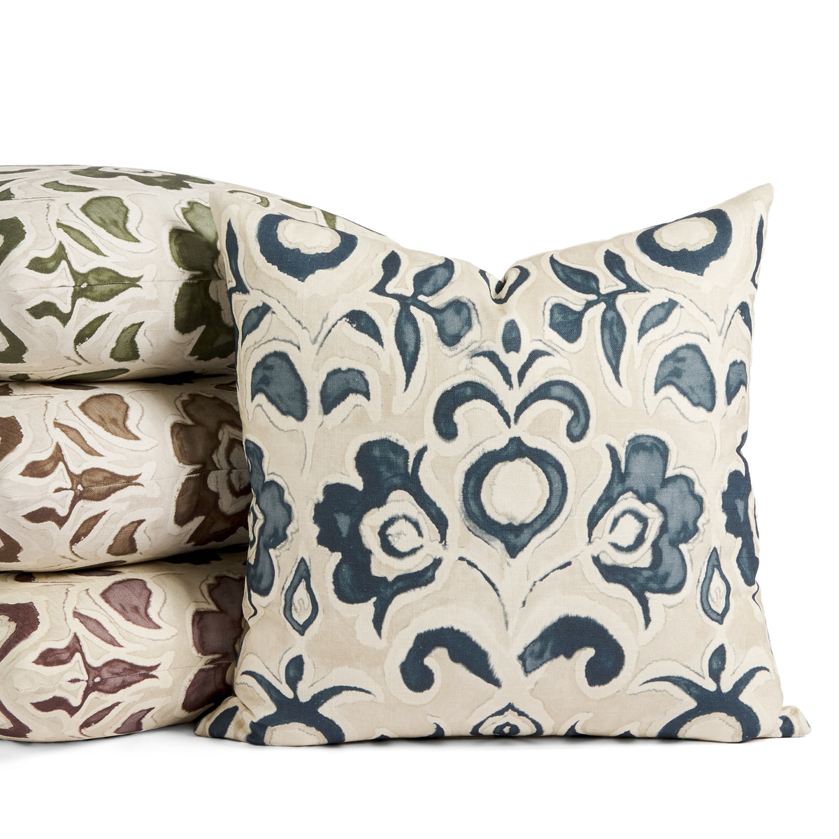 Tonic Living Paloma Ink navy blue floral pillow displayed with Paloma pillows in Olive green, Mauve purple, and Walnut brown.