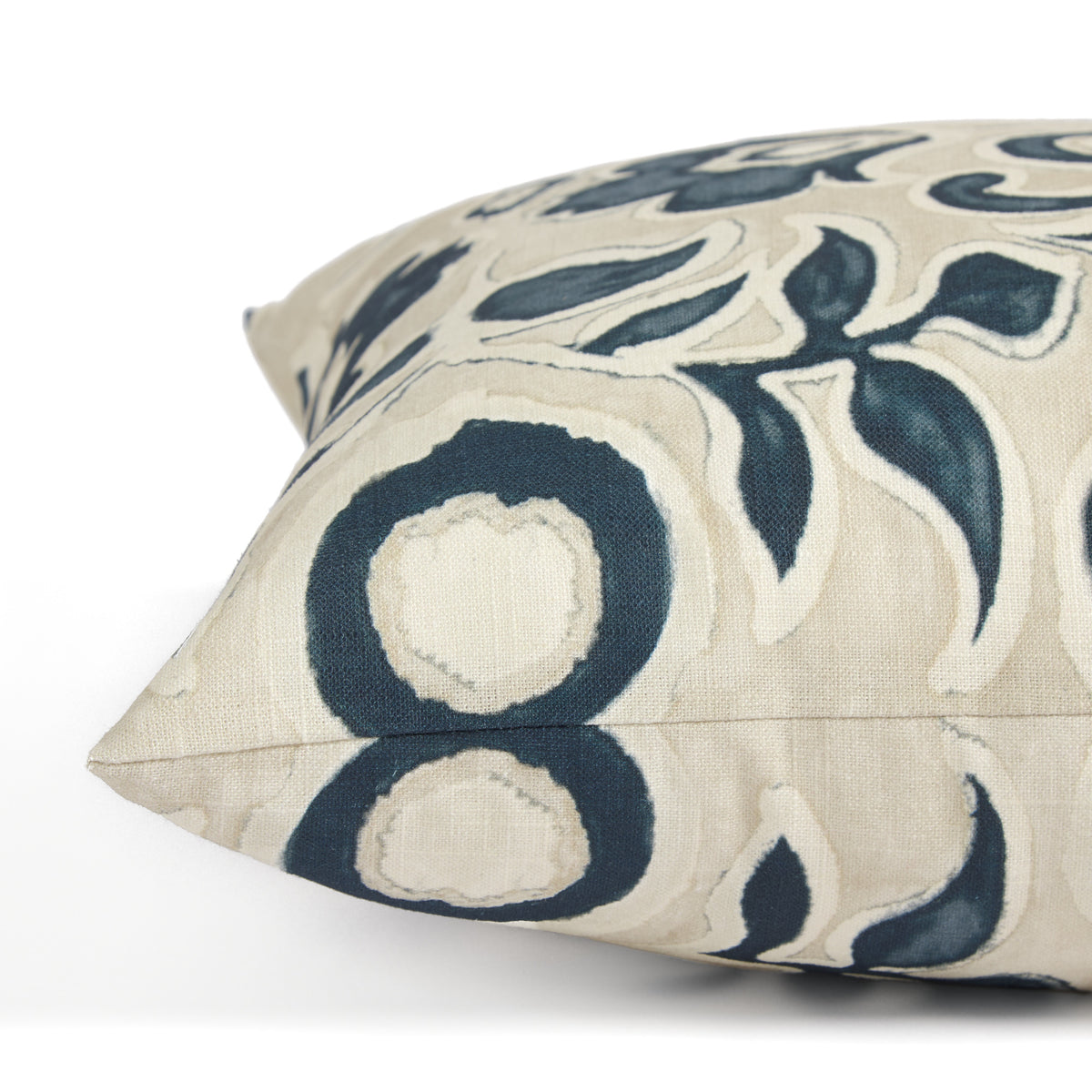 Side view of Tonic Living Paloma Ink toss cushion highlighting its stylized dark blue floral pattern and soft neutral palette.
