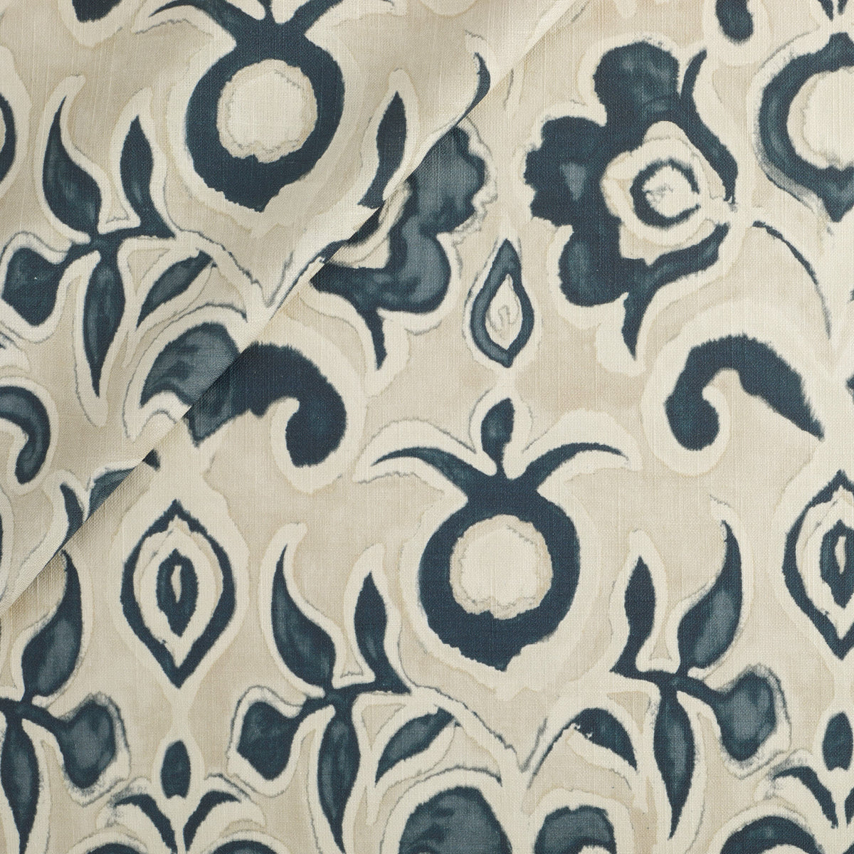 Tonic Living Paloma Fabric in Ink, a navy blue floral drapery fabric with bold blooms and scrolling leaves on an oatmeal beige ground.