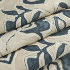Tonic Living Paloma Ink floral fabric shown as a Roman shade, featuring a stylized navy blue botanical pattern on oatmeal beige.