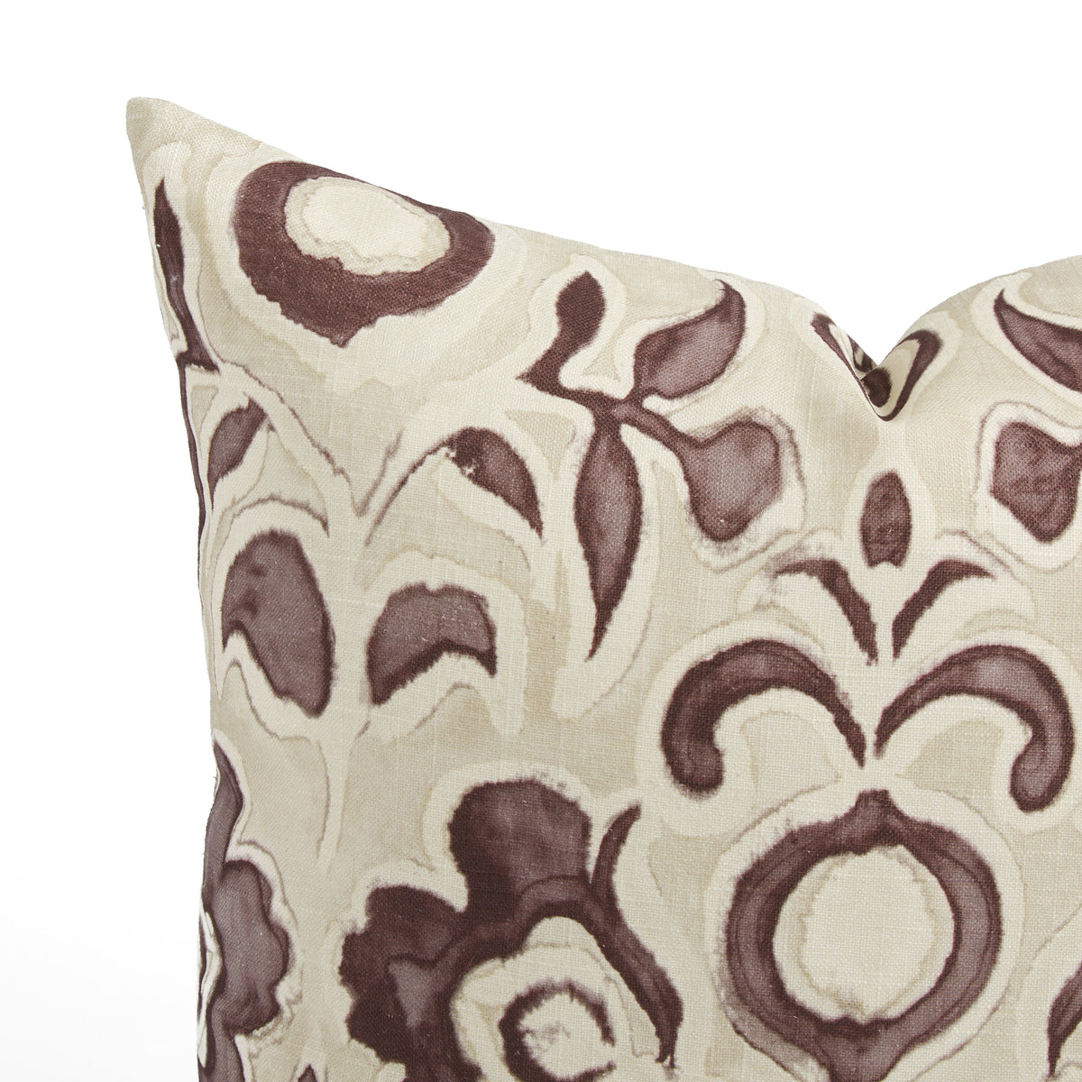 Close up of Tonic Living Paloma Mauve pillow showing painterly smoky plum flowers and scrolling leaves on oatmeal beige.