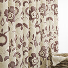 Tonic Living Paloma Mauve floral drapery fabric shown as curtains featuring a painterly smoky plum botanical pattern on oatmeal beige.