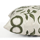 Side view of Tonic Living Paloma Olive toss cushion highlighting its stylized green floral pattern and soft neutral palette.