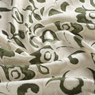 Tonic Living Paloma Fabric in Olive, an earthy green and oatmeal floral curtain fabric with a large-scale painterly botanical design.