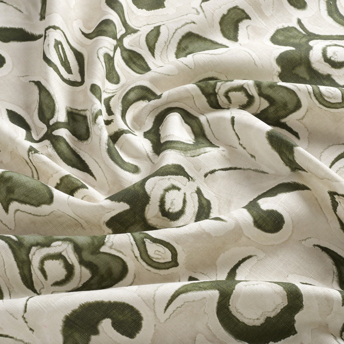 Tonic Living Paloma Fabric in Olive, an earthy green and oatmeal floral curtain fabric with a large-scale painterly botanical design.