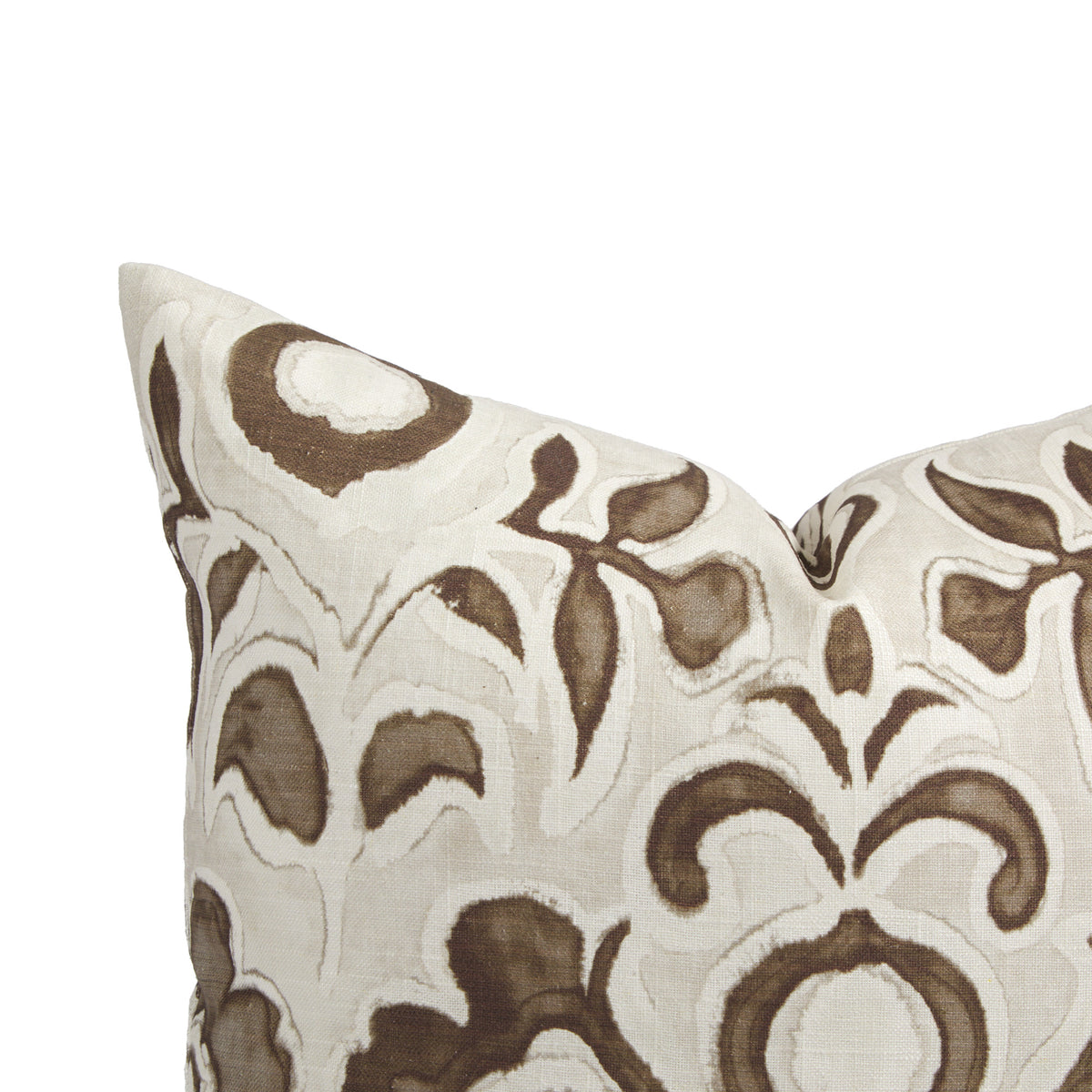 Close up of Tonic Living Paloma Walnut pillow showing painterly coffee brown flowers and scrolling leaves on oatmeal beige.